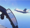 Руски Су-27П прехваща изтребител F-35 над Балтийско море